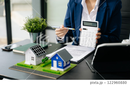 Considering buying a home, investing in real estate. Broker signs a sales agreement. agent, lease agreement, successful 122960880