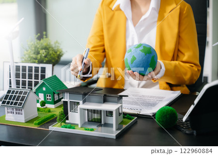 Business planning hand using laptop for working technology and business Net zero and carbon neutral concept.NET ZERO 122960884