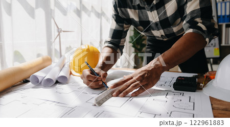 Close up of business people having consultation about wind energy at company office. Asian industry professional team Close up of business people having consultation about wind energy at company office. Asian industry professional team 122961883