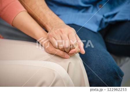 close up of two people holding hands during a therapy session, symbolizing emotional support, empathy, and trust close up of two people holding hands during a therapy session, symbolizing emotional support, empathy, and trust 122962253