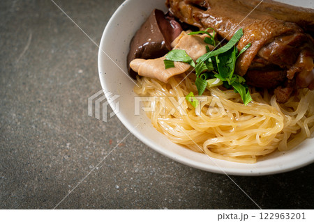 dried noodles with braised duck in white bowl dried noodles with braised duck in white bowl 122963201