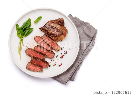 A perfectly cooked sliced striploin steak with a juicy, tender texture A perfectly cooked sliced striploin steak with a juicy, tender texture 122965615
