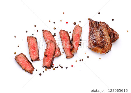A perfectly cooked sliced striploin steak with a juicy, tender texture A perfectly cooked sliced striploin steak with a juicy, tender texture 122965616