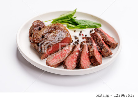 A perfectly cooked sliced striploin steak with a juicy, tender texture 122965618
