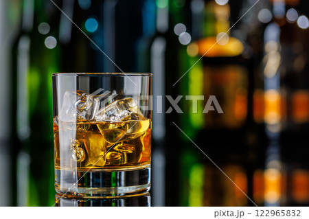 Whiskey on the rocks on a bar table 122965832