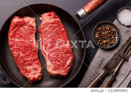Raw marbled striploin steak, fresh, rich, ready for cooking 122965902