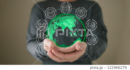 hand hold hologram to save energy,and reduce global warming,climate change,ecology friendly investment,ESG environment social governance,Green Business Innovation and Sustainable Development concept. 122966279