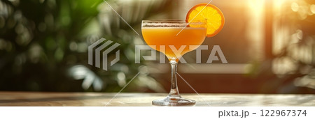 a visually appealing photo of a refreshing Screwdriver cocktail on wood table 122967374