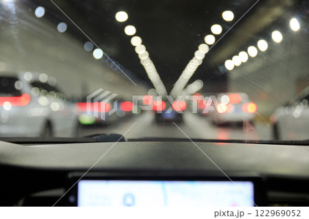 People driving car in tunnel People driving car in tunnel 122969052