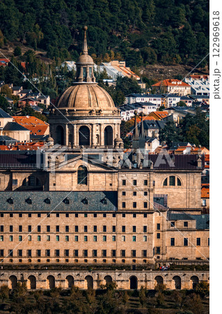 Majestic Royal Monastery of El Escorial stands proudly amidst the scenic Spanish landscape. Majestic Royal Monastery of El Escorial stands proudly amidst the scenic Spanish landscape. 122969618