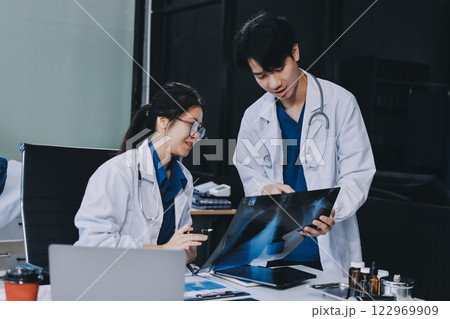 Implement those changes and we can see. Shot of a group of nurses and doctors having a meeting together. 122969909