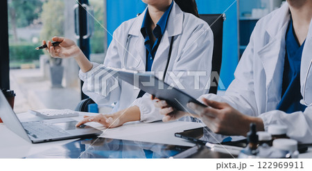 Implement those changes and we can see. Shot of a group of nurses and doctors having a meeting together. Implement those changes and we can see. Shot of a group of nurses and doctors having a meeting together. 122969911