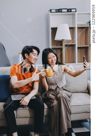 Smiling couple unpacking boxes in new house Smiling couple unpacking boxes in new house 122969959