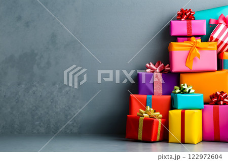 A pile of brightly colored presents with bows and ribbons 122972604