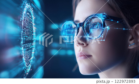 Businesswoman wearing futuristic smart glasses interacts with digital interface 122972893