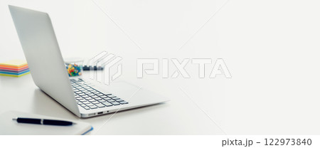Laptop on white desk, copy space 122973840