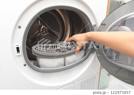Cleaning dryer lint filter. Laundry dryer Cleaning dryer lint filter. Laundry dryer 122973857