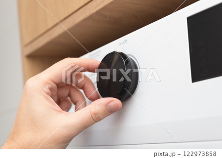 White washing machine in a utility room 122973858