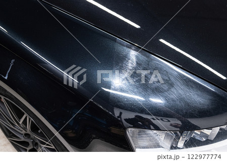 Before-after paint correction shows one side scratched 122977774