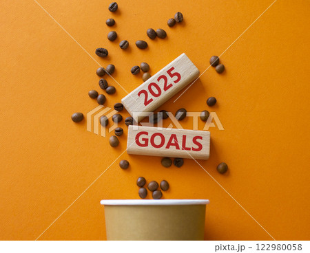 2025 Goals symbol. Concept word 2025 Goals on wooden blocks. Beautiful orange background with coffee cup. Business and 2025 Goals concept. Copy space. 122980058