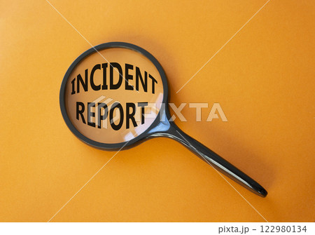 Incident Report symbol. Concept word Incident Report on magnifying glass. Beautiful orange background. Business and Incident Report concept. Copy space 122980134