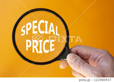 Special Price symbol. Magnifying Glass with Concept word Special Price. Businessman hand. Beautiful orange background. Business and Special Price concept. Copy space 122980457