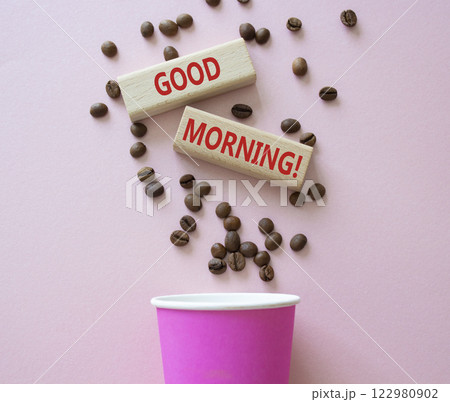 Good Morning symbol. Concept word Good Morning on wooden blocks. Beautiful pink background with coffee cup. Business and Good Morning concept. Copy space 122980902