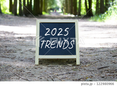 2025 Trends symbol. Blackboard with words 2025 Trends. Beautiful forest background. Business and 2025 Trends concept. Copy space. 2025 Trends symbol. Blackboard with words 2025 Trends. Beautiful forest background. Business and 2025 Trends concept. Copy space. 122980966