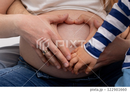 A Pregnant Mother and Her Child Sharing a Beautiful and Heartwarming Moment Together A Pregnant Mother and Her Child Sharing a Beautiful and Heartwarming Moment Together 122981660