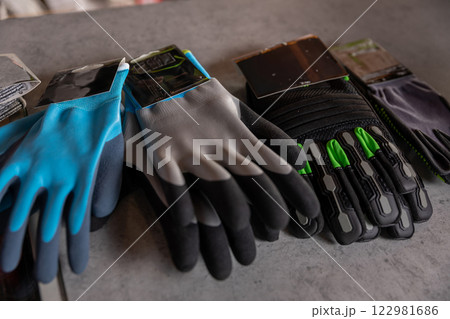Discover our durable work gloves designed for safety and protection in various tasks 122981686