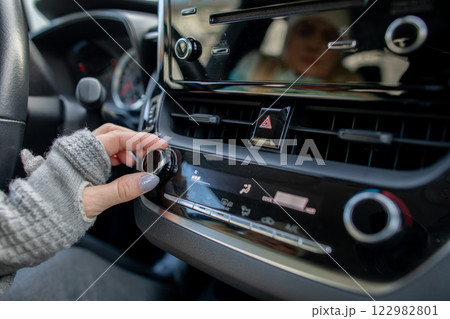 Adjusting Car Radio Settings for a Perfectly Enjoyable Driving Experience and Comfort 122982801