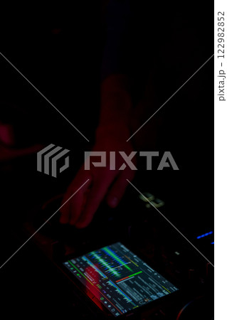 An extraordinary DJ performance with advanced equipment and vibrant lights that captivates all 122982852