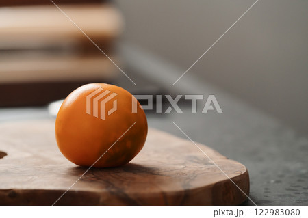 Lulo fruit on olive wood board on kitchen countertop Lulo fruit on olive wood board on kitchen countertop 122983080