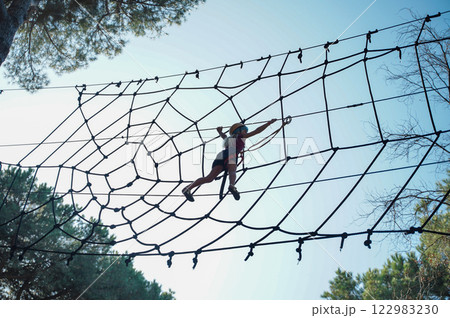Child in forest adventure park 122983230