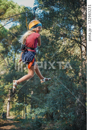 Child in forest adventure park 122983231