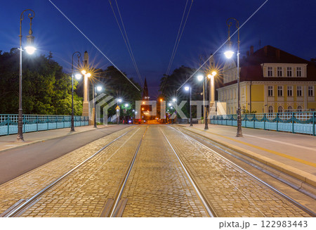 The Church of the Holy Saviour in Poznan and the Theatre Bridge at dawn. 122983443