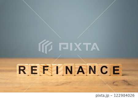 Blocks with the inscription Refinance. Process of replacing an existing loan with a new one, to secure better terms such as a lower interest rate or reduced monthly payments 122984026
