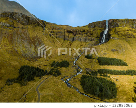 Breathtaking aerial perspective of the magnificent bjarnarfoss waterfall in the picturesque snaefellsnes peninsula, west iceland, showcasing its natural beauty 122985068