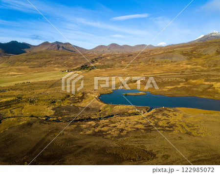 Aerial perspective of snaefellsnes peninsula, featuring volcanic peaks, a lake, and a river winding through the picturesque autumn scenery in iceland Aerial perspective of snaefellsnes peninsula, featuring volcanic peaks, a lake, and a river winding through the picturesque autumn scenery in iceland 122985072