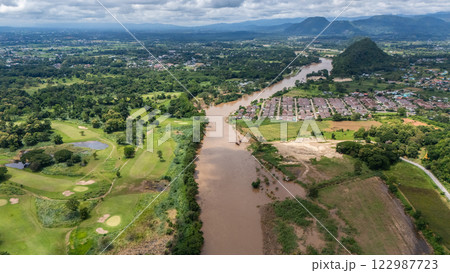 Aerial view of Mae Kok river flowing through Chiang Rai province of Thailand. This river is the blood line for people of Chiang Rai, started from the hills on boarder of Myanmar. 122987723