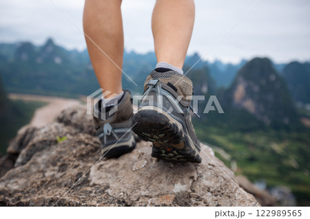 climbing to the top of mountain and enjoy baeautiful landscape of yangshuo county, China 122989565