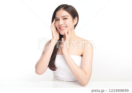 Beautiful young asian woman with clean fresh skin on white background, Face care, Facial treatment, Cosmetology, beauty and spa, Asian women portrait. Beautiful young asian woman with clean fresh skin on white background, Face care, Facial treatment, Cosmetology, beauty and spa, Asian women portrait. 122989699