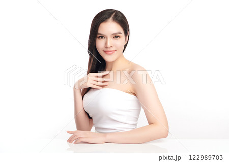 Beautiful young asian woman with clean fresh skin on white background, Face care, Facial treatment, Cosmetology, beauty and spa, Asian women portrait. Beautiful young asian woman with clean fresh skin on white background, Face care, Facial treatment, Cosmetology, beauty and spa, Asian women portrait. 122989703