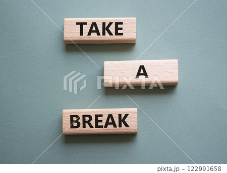 Take a break symbol. Concept words Take a break on wooden blocks. Beautiful grey green background. Business and Take a break concept. Copy space. 122991658