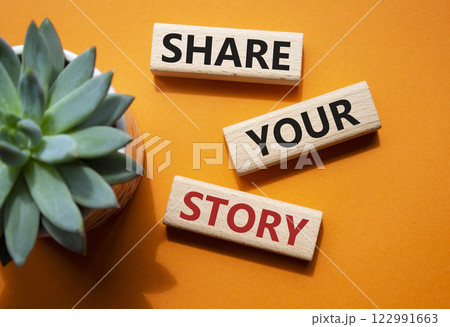 Share your story symbol. Wooden blocks with words Share your story. Beautiful orange background with succulent plant. Business and Share your story concept. Copy space. 122991663