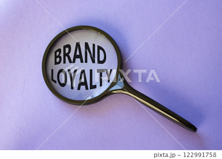 Brand Loyalty symbol. Concept word Brand Loyalty on magnifying glass. Beautiful purple background. Business and Brand Loyalty concept. Copy space. Brand Loyalty symbol. Concept word Brand Loyalty on magnifying glass. Beautiful purple background. Business and Brand Loyalty concept. Copy space. 122991758