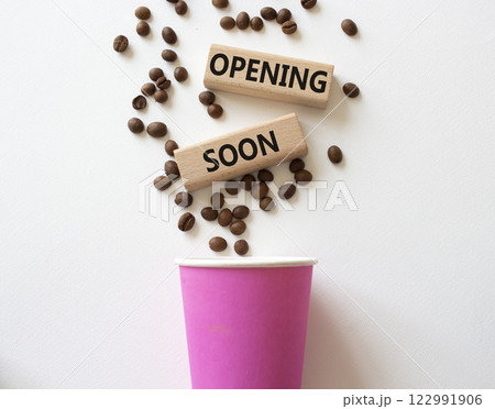 Opening soon symbol. Concept word Opening soon on wooden blocks. Beautiful white background. Business and Opening soon concept. Copy space 122991906