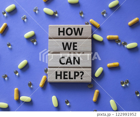 How we can help symbol. Concept word How we can help on wooden blocks. Beautiful purple background with pills. Medicine and How we can help concept. Copy space 122991952