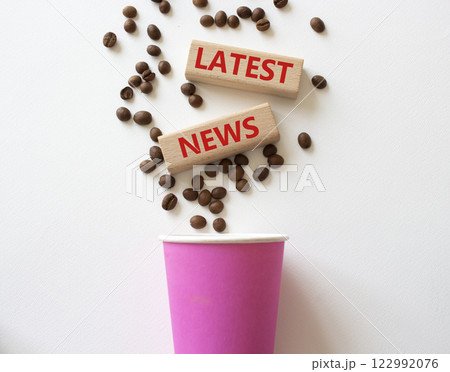 Latest News symbol. Concept word Latest News on wooden blocks. Beautiful white background with coffee cup. Business and Latest News concept. Copy space Latest News symbol. Concept word Latest News on wooden blocks. Beautiful white background with coffee cup. Business and Latest News concept. Copy space 122992076