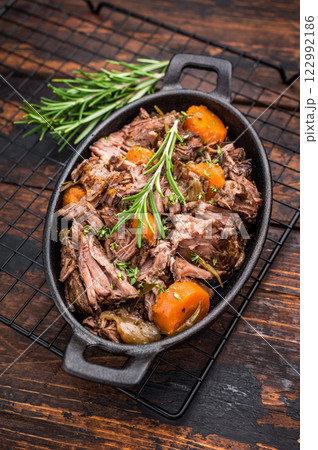 Skillet of beef bourguignon with tender beef, carrots, and mushrooms. wooden background. top view Skillet of beef bourguignon with tender beef, carrots, and mushrooms. wooden background. top view 122992186